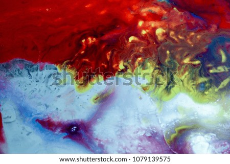 Abstract liquid milk flowing pattern like nebulae in the universe with different colours of white, blue, red and pink. Copy space area for space exploration ideas and concepts