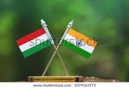 India and Hungary small flag with blur green background
