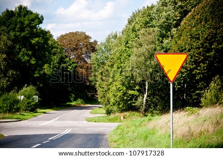 yield sign near crossroad
