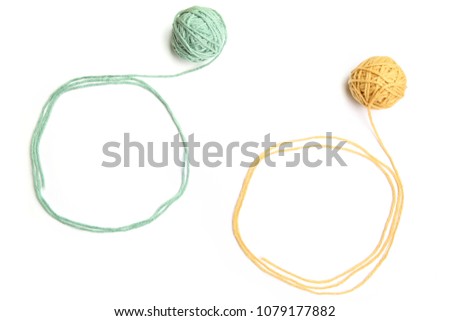 Thread balls with frames made of thread isolated on white background. Yellow and green cotton thread balls with empty frames.