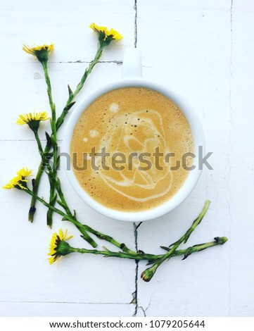 Coffee and flowers on a white background