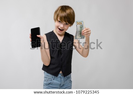 Cute boy with telephone and cash