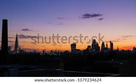 View of the skyline of London with skyscrapers at sunset, United Kigdom