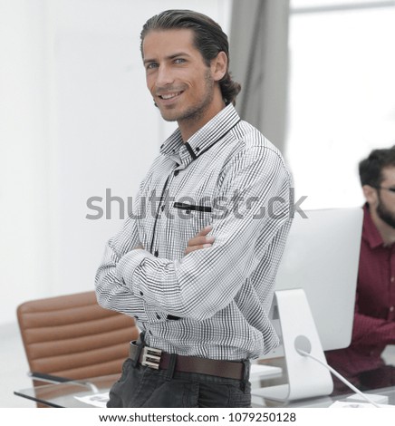 serious businessman standing in office