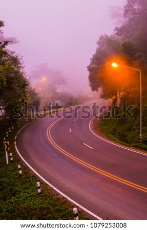 Curve road with fog, Thailand.