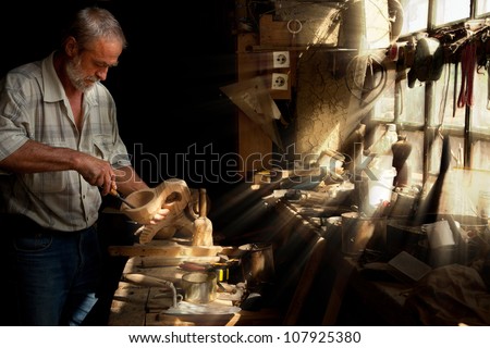 Summer sun beams shining on the hands of a skilled carpenter Royalty-Free Stock Photo #107925380
