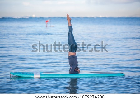 SUP Yoga Instructor on the water