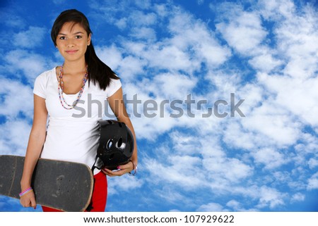 Girl skateboarding outside on a nice day