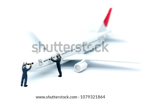 Miniature people , worker or Housewife cleaning on  air plane using for business trip concept.