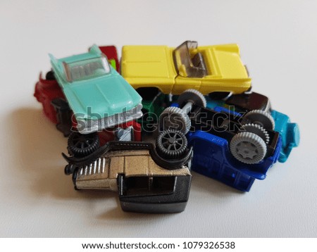 plastic cars toys differend colors set isolated
