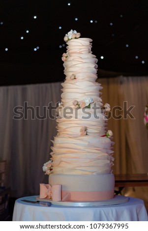 Peach coloured layered wedding cake