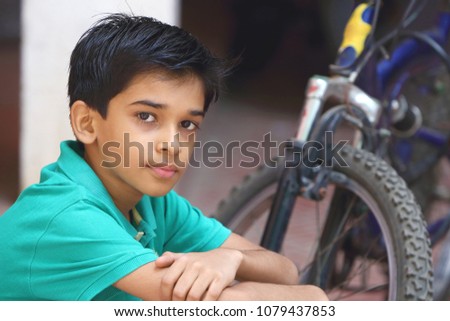      Indian Cute Boy with Cycle 