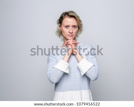 Adult sad woman posing in studio. Negative emotions..