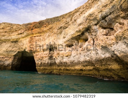 Cave in Praia da Marinha. The cave can be visited from boats in Algarve, In the south of Portugal