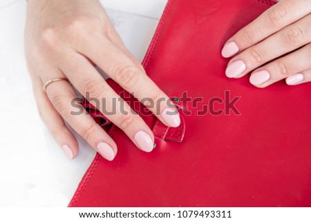 Picture of women hand whit pen and daily planner