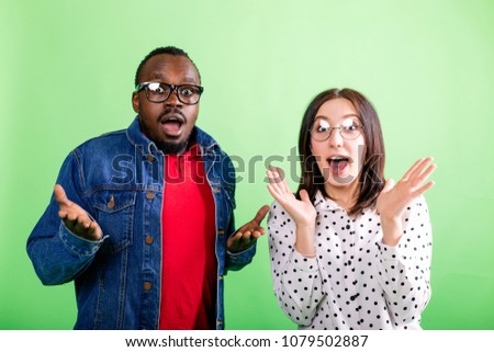 African man and girl at the meeting raised their hands in surprise showing positive emotions and joy