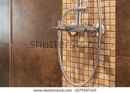 Stainless faucet for cold and hot water in the bathroom.