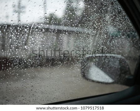 water drop on glass of windows car in rainy season