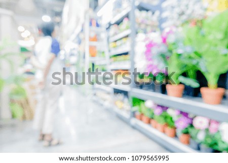 Blured or defocused photography of modern department store.Perspective of shelf with many goods or product.Shopping business background concept.