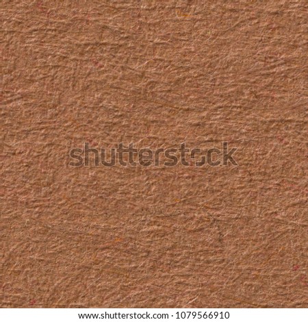 Brown paper texture with contrast reliefs. Seamless square background, tile ready. High resolution photo.