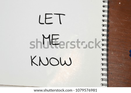 Let me know word written on white paper