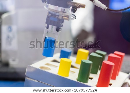Robotic arm pick and place automation;process of picking parts up and placing them in new location Royalty-Free Stock Photo #1079577524