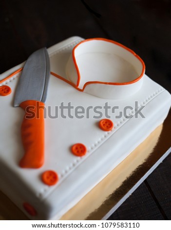 birthday cake for chef. cake with mastic. delicious beautiful cake for the anniversary of the opening of the restaurant. cake in the form of a cook with a knife