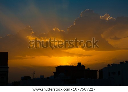 Sunrise with dramatic clouds and sun rays in countryside of Jeddah, Saudi arabia