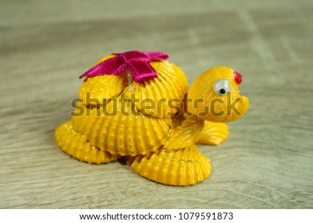 Yellow turtle made of shell