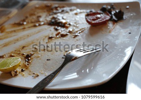 
waste food on white 
dirty dish