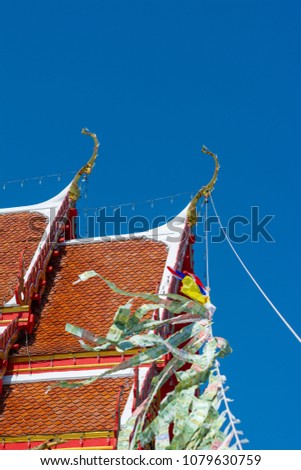 Thai Baht is on Blue Sky, in the Temple fair, Thailand