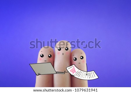 Three fingers decorated as three person using online shopping to purchase items.