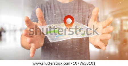 View of a Man holding a 3d rendering pin holder on a map