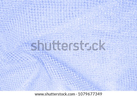 Blue silver mesh fabric, with a woven metallic thread. Attractive mesh lace in a blue regatta with silver metal reflections. Very light and clean, perfect as an overhead fabric.