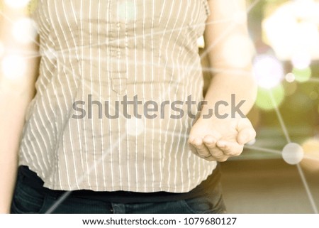 Photo of woman focusing in her opened hand on a sunny day. It might be used to adapt the message with other compositions.