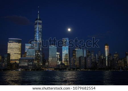 
Manhattan skyline at sunset with view from New Jersey at evening