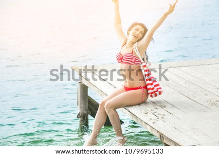 Cheerful woman on the beach