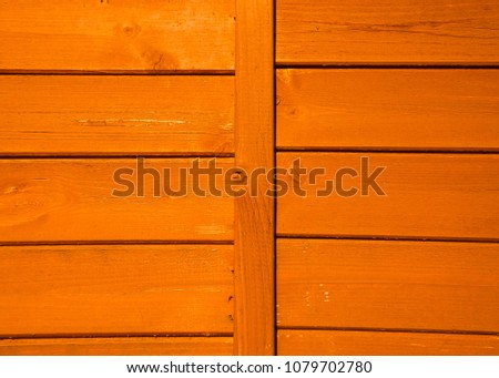 Fresh bright orange color of a wall from a natural wood. Texture and background. Interior Design