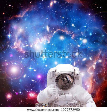 Astronaut flying in space. Galaxies and nebula. The elements of this image furnished by NASA.
