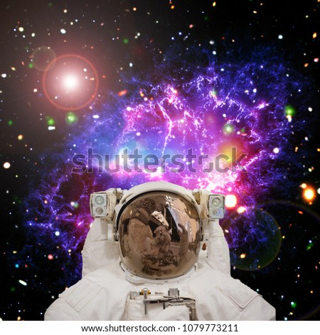Astronaut surfing dark space with stars and galaxies. The elements of this image furnished by NASA.