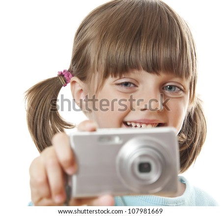 little girl with digital compact camera