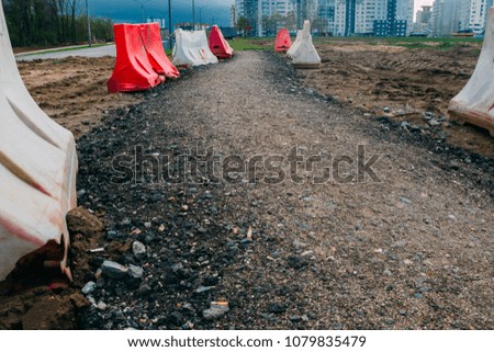  temporary road for pedestrians through mud. repair work in the city.