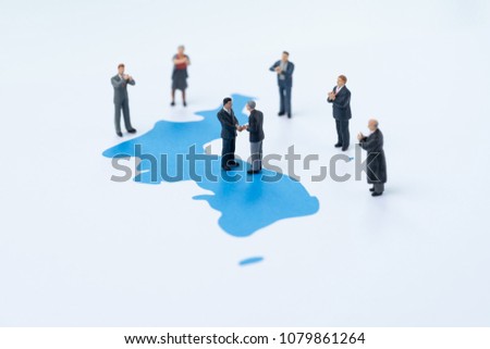 North and south korea peace, end war and denuclearization concept, miniature people country leader shake hands on Korea unification flag with other happy people admiring and clapping. Royalty-Free Stock Photo #1079861264