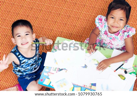 Cheerful Kids Enjoy Writing Alphabet and Drawing Picture with Color Pencil in Homework at Lovely Family House