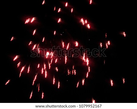 Red fireworks falling fire explosion blurred background