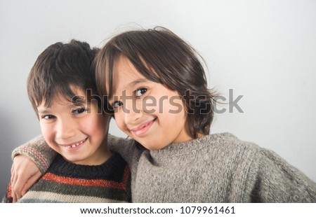 Two happy brothers hugging