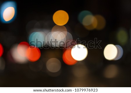 Elegance bokeh lights from traffic and city lights for background and texture.