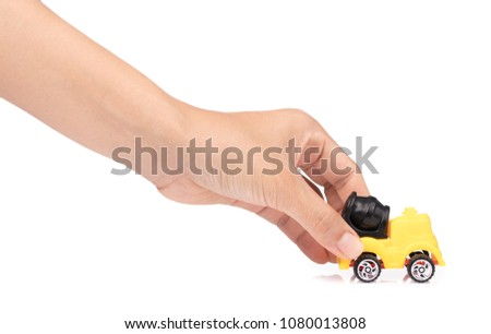 hand holding toy truck Concrete mixe isolated over white background