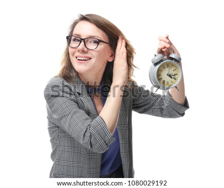 Mature woman with alarm clock on white background. Time management concept