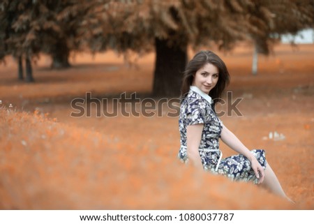 Beautiful girl for a walk in autumn